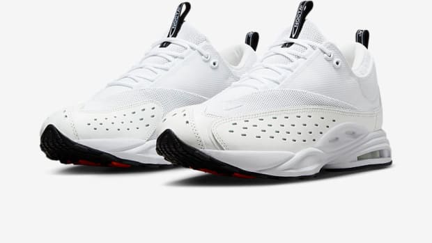 Side view of Drake's white and black NOCTA x Nike sneakers.